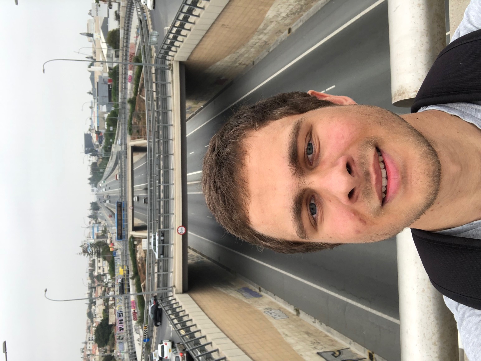Selfie on a walk toward the Agios Athanasios bridge with the road and bridge in the background