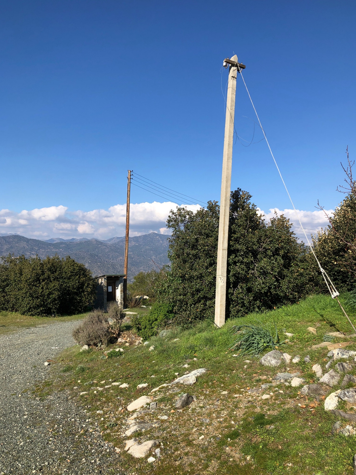 Small stone hut and old power pole at the Kakomalis picnic site