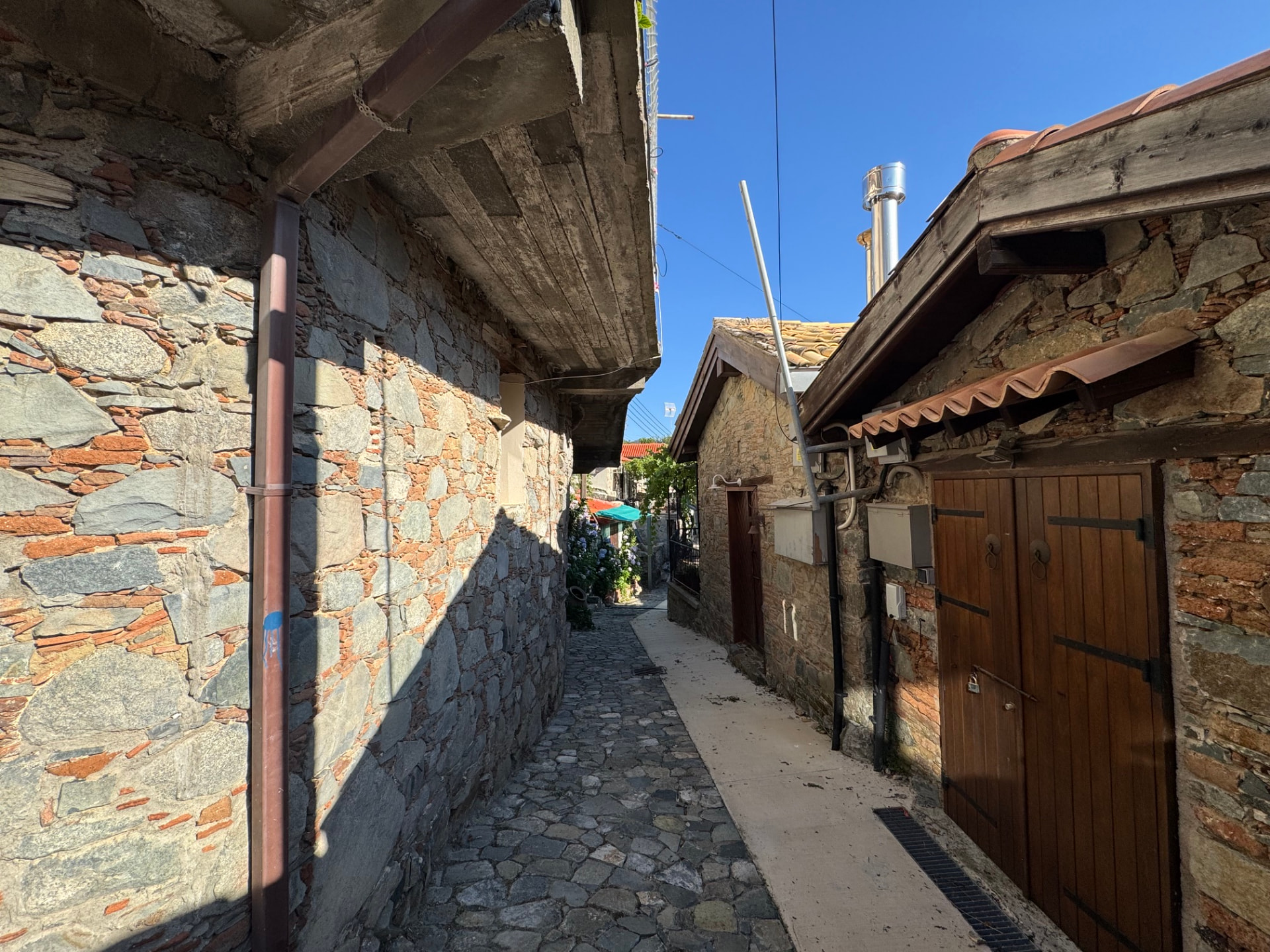 A narrow stone lane between village houses
