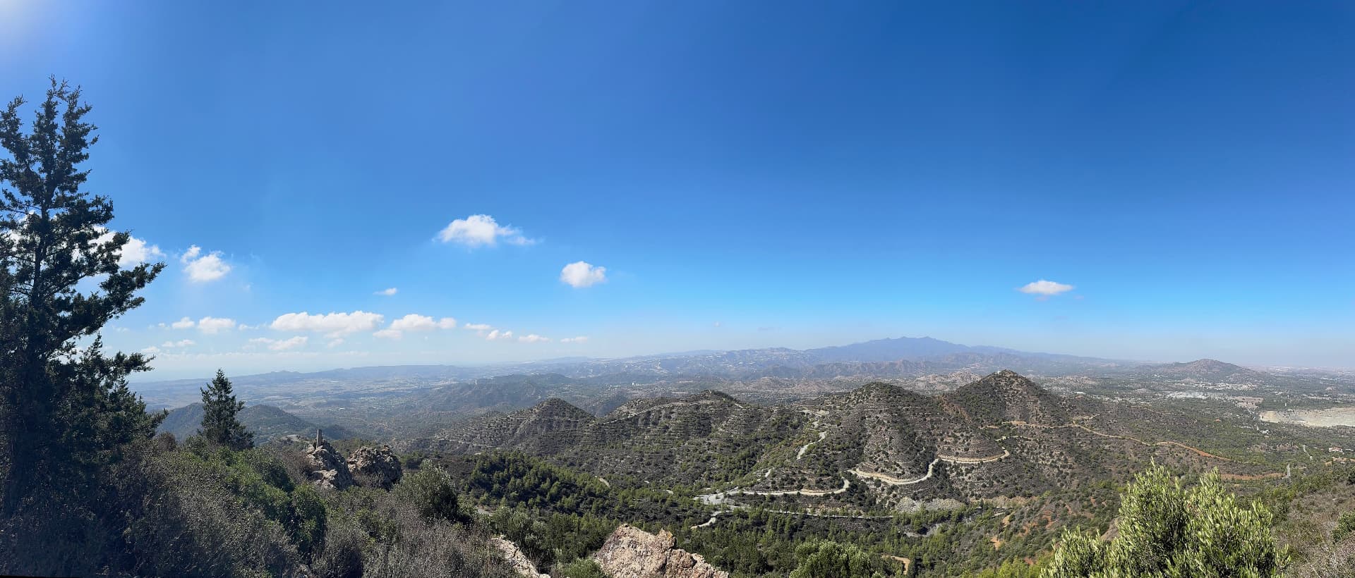 A panorama of ridges and hills under a deep blue sky